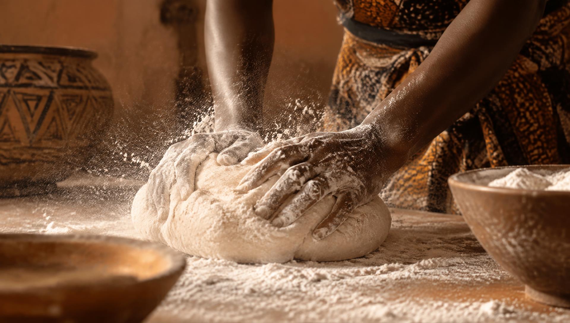 Hands kneading traditional bread dough